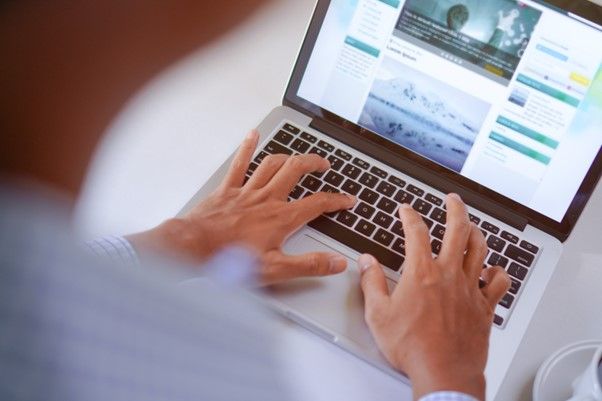 Men Typing on Laptop Keyboard